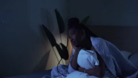 Person with sleep problems sitting in a dark room Video stock 332300818