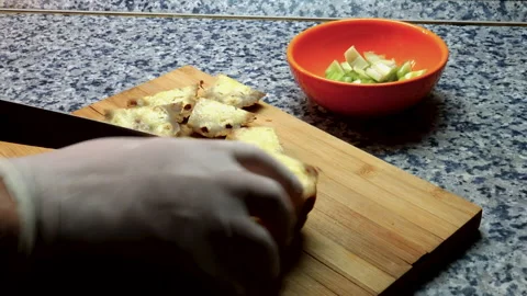 A person is slicing pineapple fruit probably for fresh juice Video stock 141160323