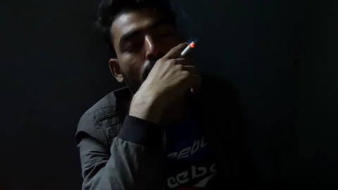 Person smoking cigarette in slow motion Stock Footage 248444882