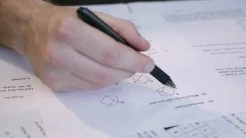 Person Solving Questions on Written Test Sheet, Education and Learning Concept Stock Footage 332138316