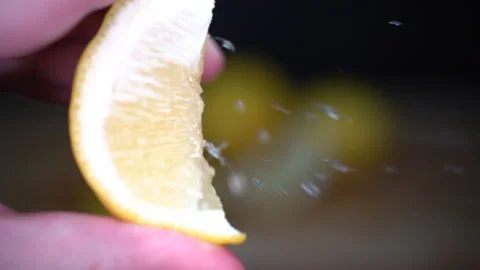 Person squeezes a lemon, Close up macro of lemon Video stock 140073011