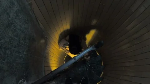 Person in a Stairwell with Dramatic Lighting Stock Footage 335588166