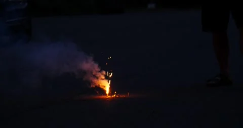 Person Standing by Fire in the Dark Stock Footage 262399375