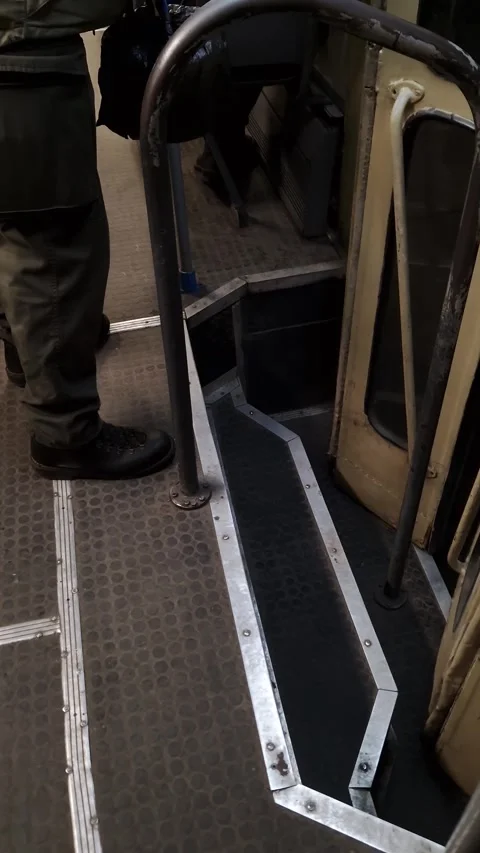 Person Standing Inside Old Bus Near Worn Metal Steps Stock Footage 326061301