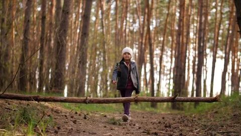 A person standing next to a tree in a forest Stock Footage 129792028