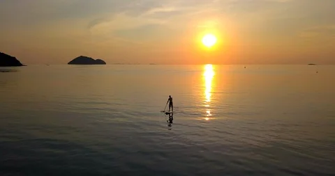 Person standing up at paddle board Stock Footage 88992703