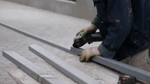 Person standing on platform with roller skates in industrial setting, side view Stock Footage 344822020