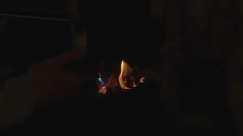 A Person starting up a small fire with a hand torch, Close up Video stock 167795670