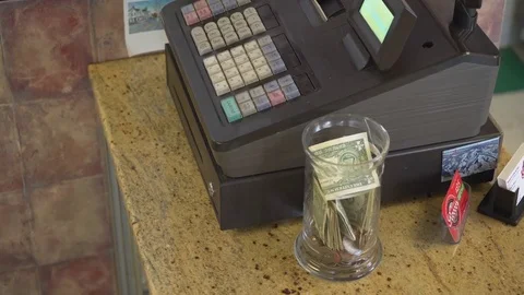 Person steals from the tip jar Stock-Footage 73894447