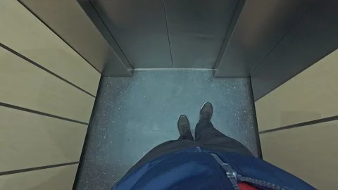 Person Stepping Out of Elevator Onto Tiled Floor Seen From First Person Per.. 動画素材 332944982