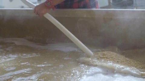 Person stirring grains in a container Stock Footage 87801715