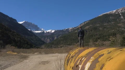 Person stood on yellow structure looking out over view Stock Footage 102526475