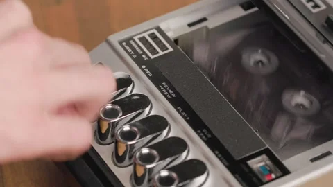 Person stops playback and ejecting cassette from vintage tape recorder Stock Footage 303139015
