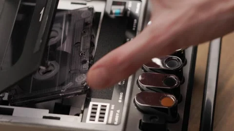 Person stops playback and ejecting cassette from vintage tape recorder Stock Footage 303139036