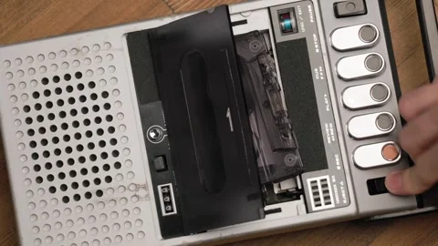 Person stops playback and ejecting cassette from vintage tape recorder Stock Footage 303139047