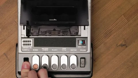 Person stops playback and ejecting cassette from vintage tape recorder Stock Footage 303139063