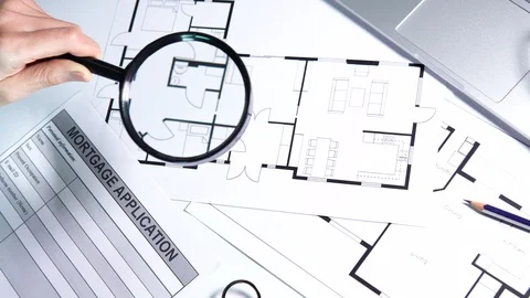 Person studying drafts going to fill out mortgage application, dwelling purchase Stock Footage 121583568