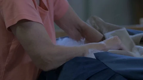 Person Stuffing Cushion Stock-Footage 100852313
