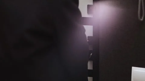 Person in suit using a key card to open a modern door in a hotel or office Stock Footage 339070887