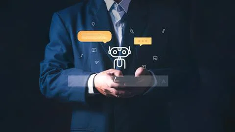 Person in a suit using a smartphone with chat icons Stock Photos