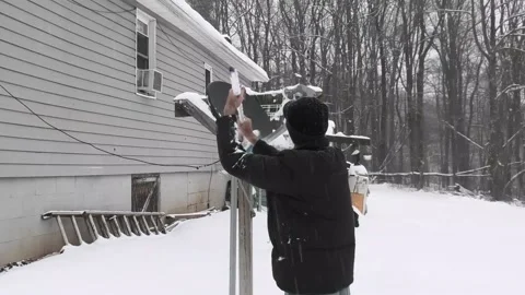 A Person Sweeps Snow Stock Footage 145232062