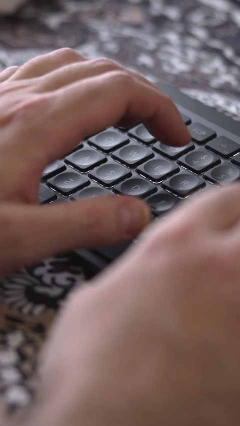 Person Swiftly Inputting Data On Keyboard. Rapid Keystrokes Executed On Stock Footage 346987228