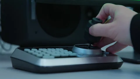 A person is switching cameras with a controller Video stock 300748322