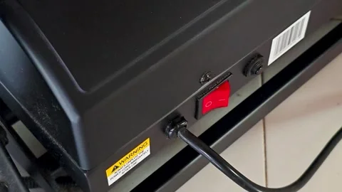 A person switching off a machine using their big toe. 4K Video stock 328428036