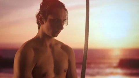 Person with sword posing at camera. Young man half naked with japanese sword Stock Footage 270181166