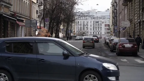 Person in t rex costume prankster running at city street crosswalk Stock Footage 84929341