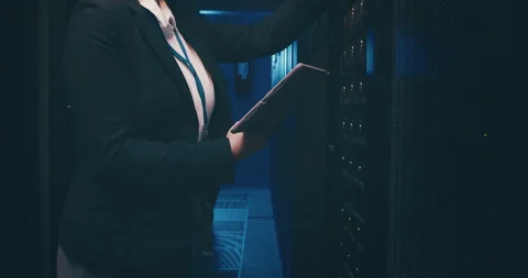 Person, tablet and server room for inspection, programming and coding of system Stock Footage 261971586