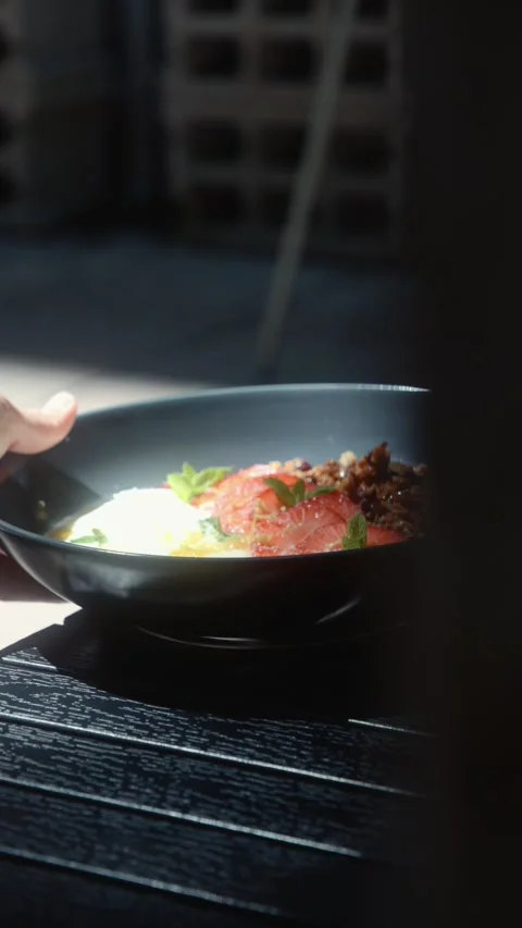 Person Taking Breakfast Bowl from Table Stock Footage 339275550