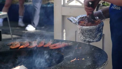 Person taking fried prawns Stock Footage 204813409