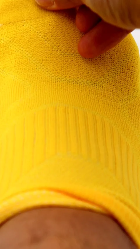 A person taking off their socks Stock Footage 335531986
