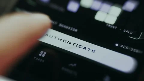 Person taps the Authenticate button to confirm identity for secure access Stock Footage 335456796
