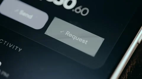Person taps the button labeled Request from a financial app Stock Footage 331579371