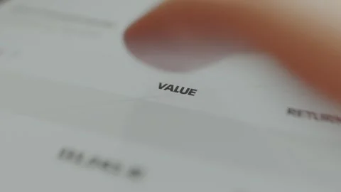 Person taps the button labeled VALUE, an upward arrow appears next to the button Stock Footage 330249879