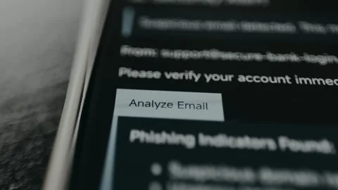 Person taps the digital button Analyze Email, result shown is Phishing Stock Footage 332891221