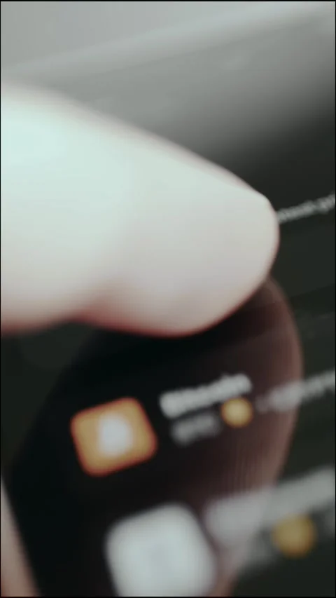 Person taps the digital button labeled Stocks Stock-Footage 330251573