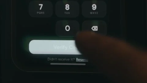 Person taps the digital button labeled Verify Code, status Verified Stock Footage 333831150