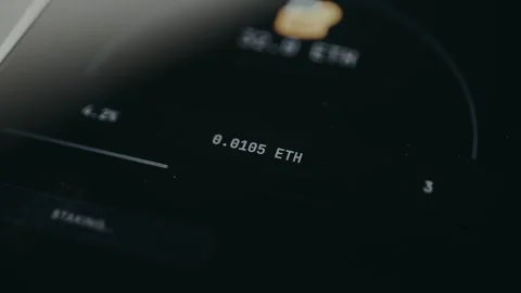 Person taps the option STAKE ETH, earning rewards Stock Footage 332062132