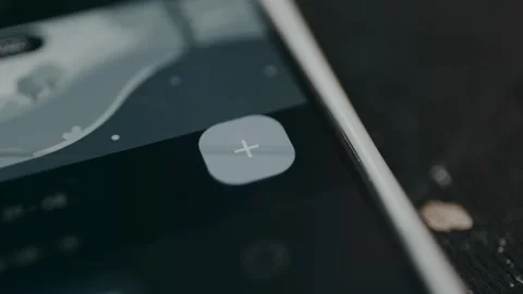 Person taps the plus digital button to add new data in the Expense category Stockbeeldmateriaal 329285621