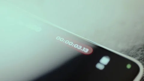 Person taps the recording function, time counter suggests an active recording Stock Footage 326946298