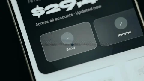 Person taps the Send option for transaction within a banking application Stock Footage 331170896
