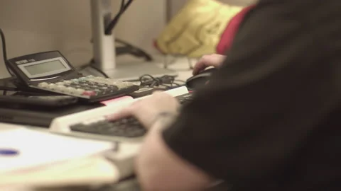PERSON WITH TATTOOS OPERATES KEYBOARD Stock Footage 216978451