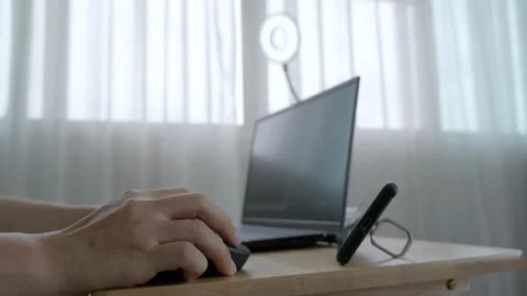 A person teaching online class and meeting using a laptop computer. Video stock 155345559