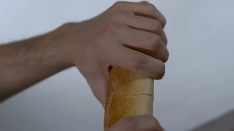 Person tearing bread in half Stock Footage 100009239