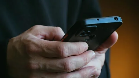 Person texting message or scrolling on a smartphone Stock Footage 337893291