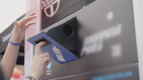 Person throughs empty plastic bottle for recycling process. Stock Footage 277318563