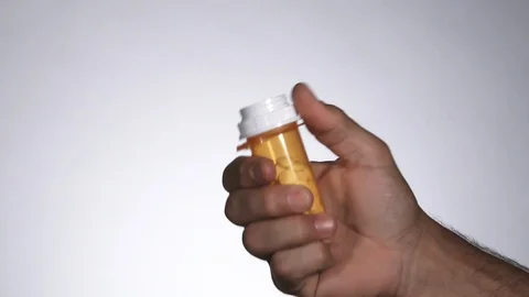Person Throwing Away Medication Stock Footage 114830560
